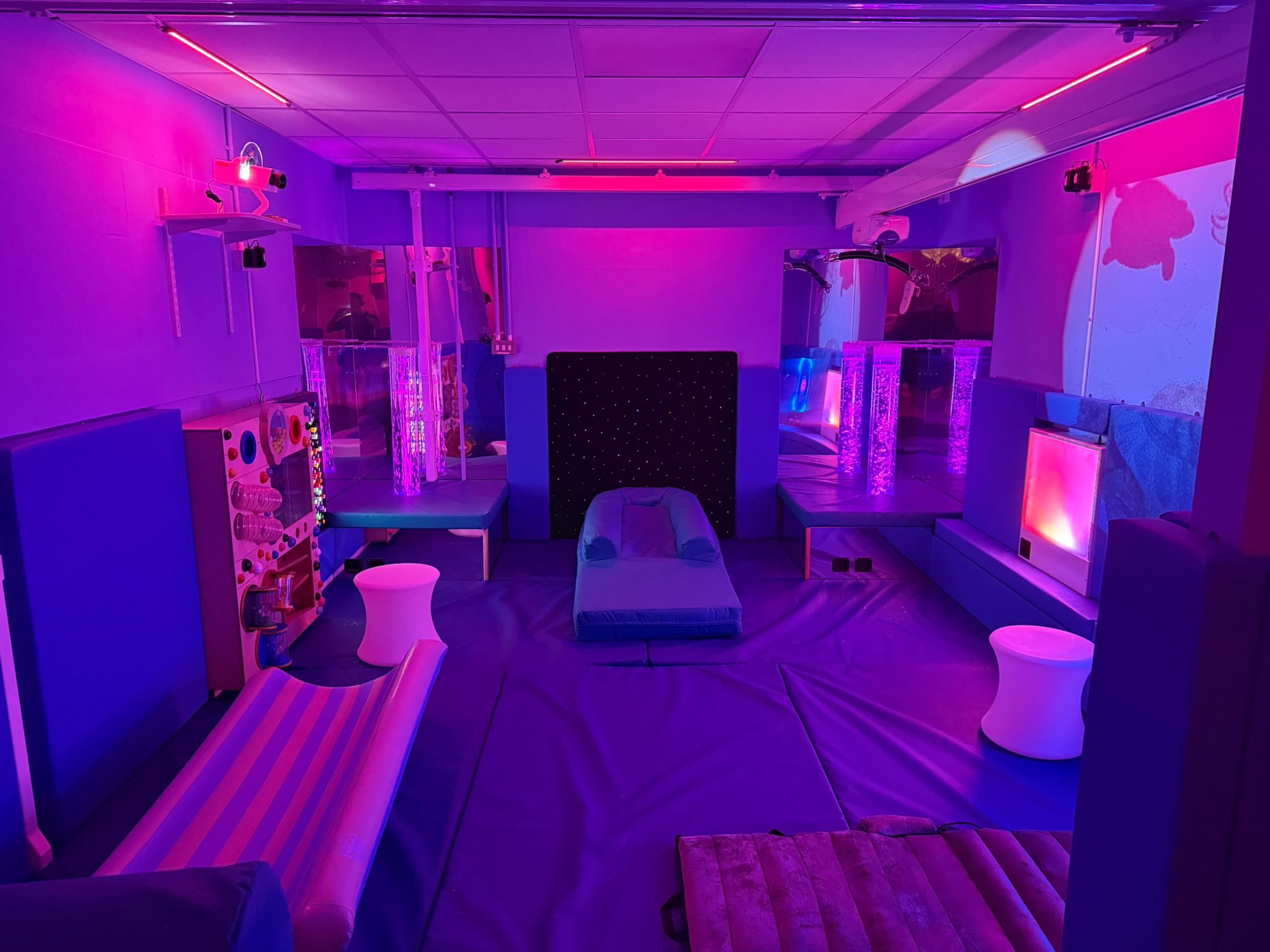 Multi-sensory room at Park Lane Special School with gentle lighting, interactive panels and padding