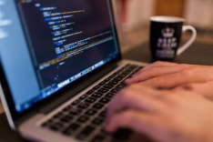 Photo of someone coding on a laptop