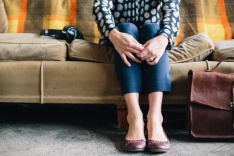 Photo of a woman sitting on a sofa