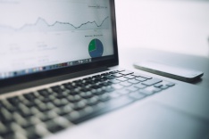 Photo of a laptop with an analytics page open