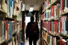 Photo of a student in a library 