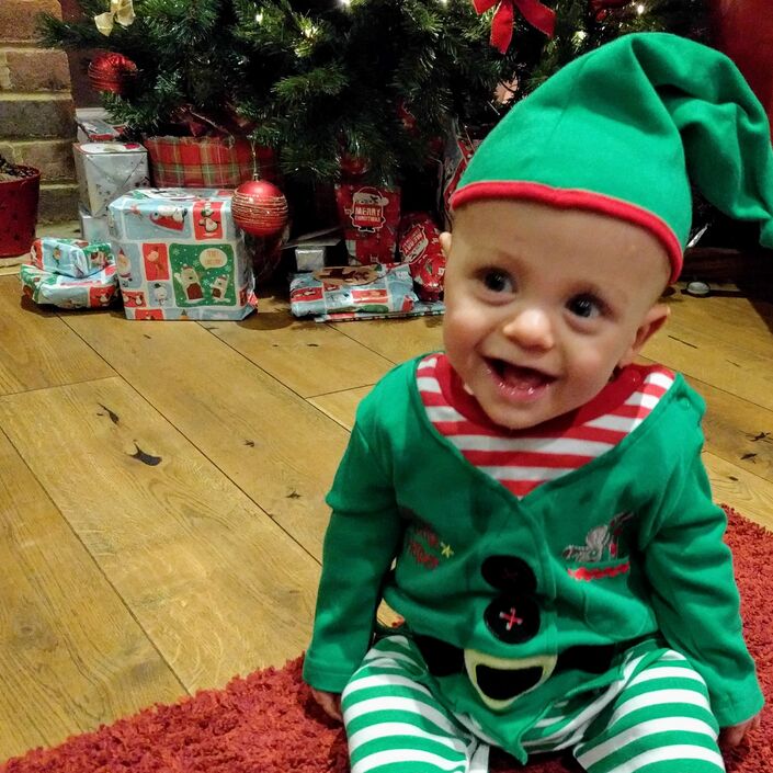 Baby dressed as an elf