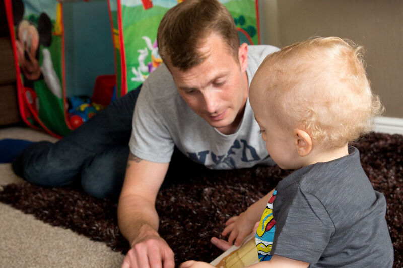 Father playing with his baby son