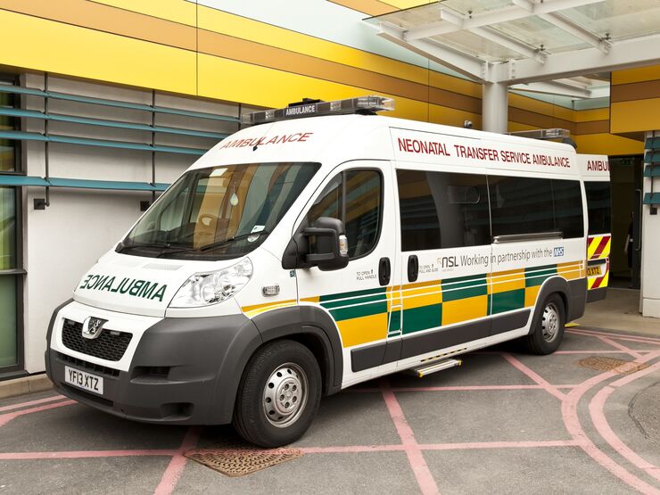 Photo of an ambulance outside a hospital