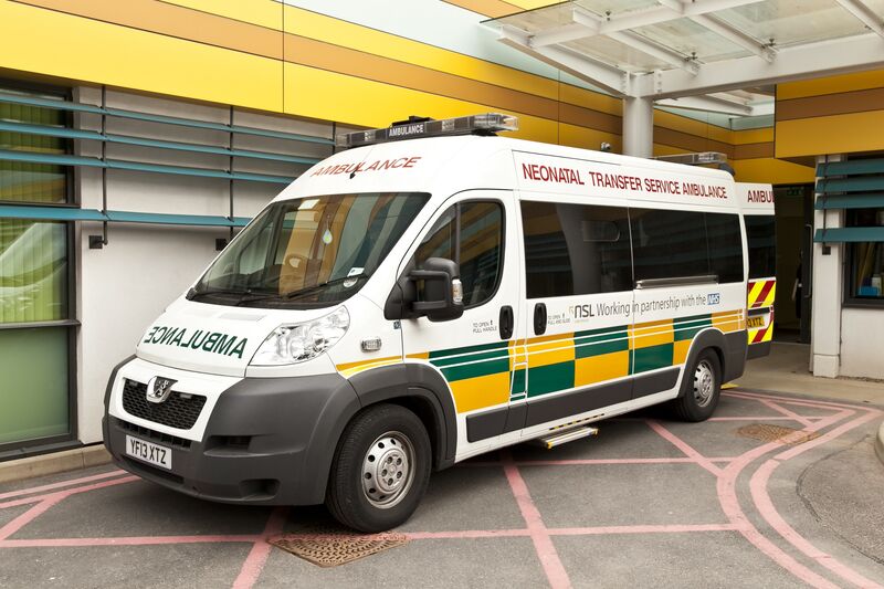 Photo of an ambulance outside a hospital