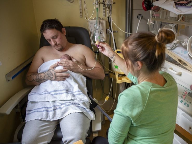 Parents doing skin-to-skin and tube feeding