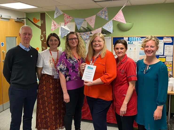 St Peter's hospital staff posing while holding a Bliss accreditation plaque