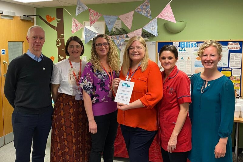 St Peter's hospital staff posing while holding a Bliss accreditation plaque