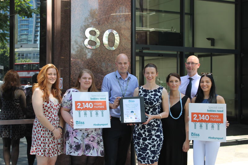 Bliss Chief Executive and Campaigns Manager posing with posters containing findings of 2015 Bliss baby report