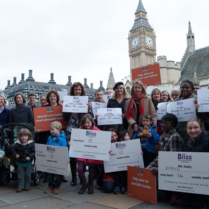 Campaigners outside Houses of Parliament with Bliss campaigning boards
