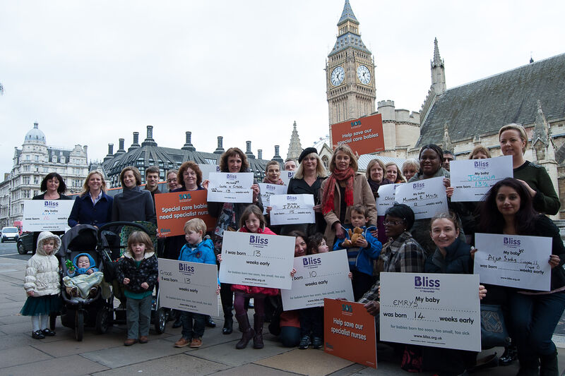 Campaigners outside Houses of Parliament with Bliss campaigning boards