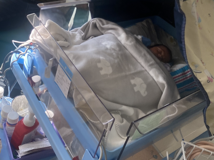 Iram's baby Adam in an incubator on the neonatal unit