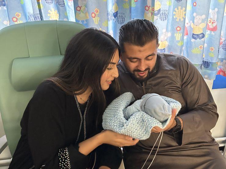 Farhaa and Wasim holding Riyadh