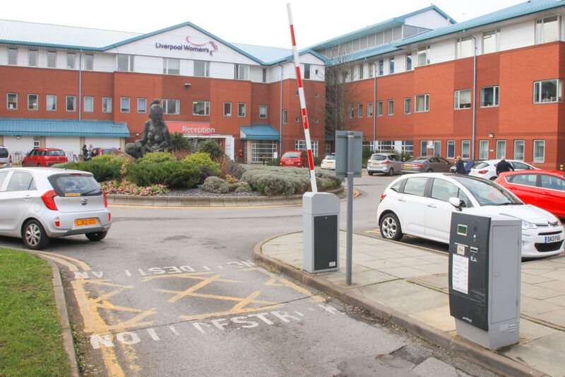 Hospital car park with cars parked