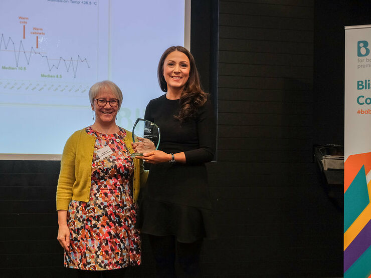 Dr. Still being presented award by Dr. Lydia Bowden