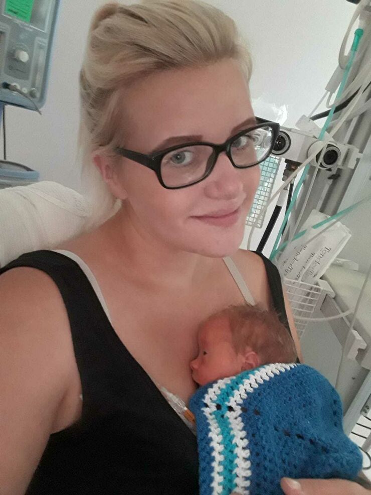 Kerry holds baby Kane in hospital
