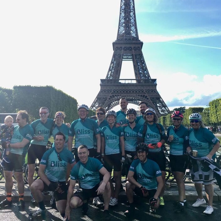 Team Bliss at the Eiffel Tower during London to Paris cycle challenge