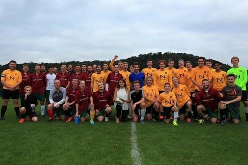 group of football players posing together