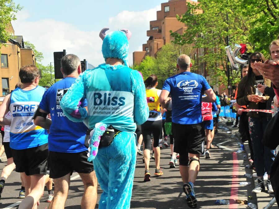 Man dressed as monsters inc character running for Bliss