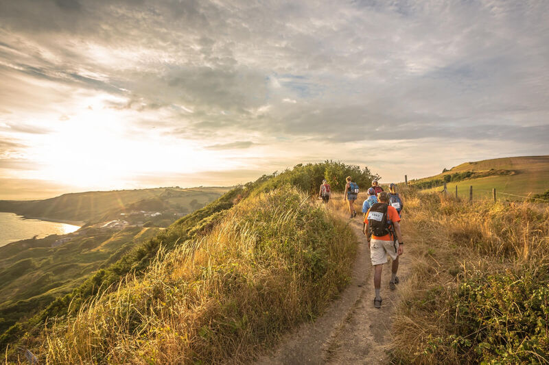 People hiking in the beautiful Yorkshire countryside during sunset