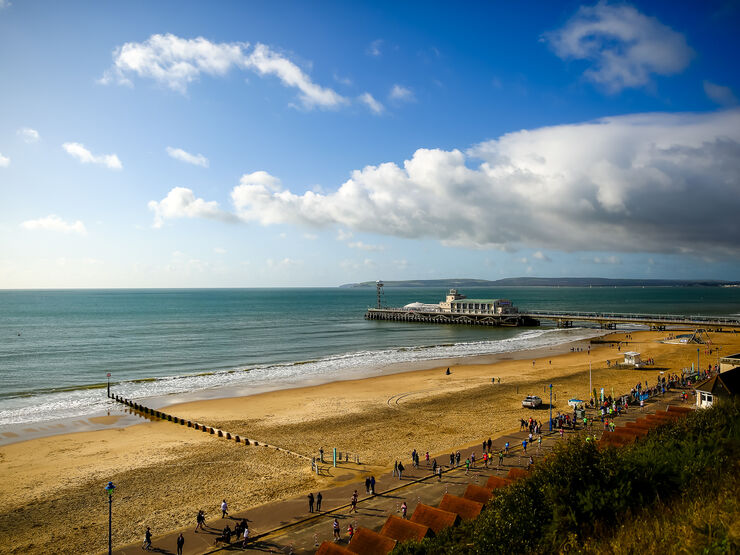 Photo of Bournemouth beach with blue sky and a few clouds