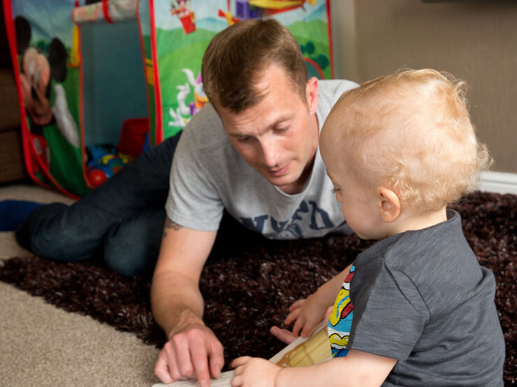 Father playing with his baby son