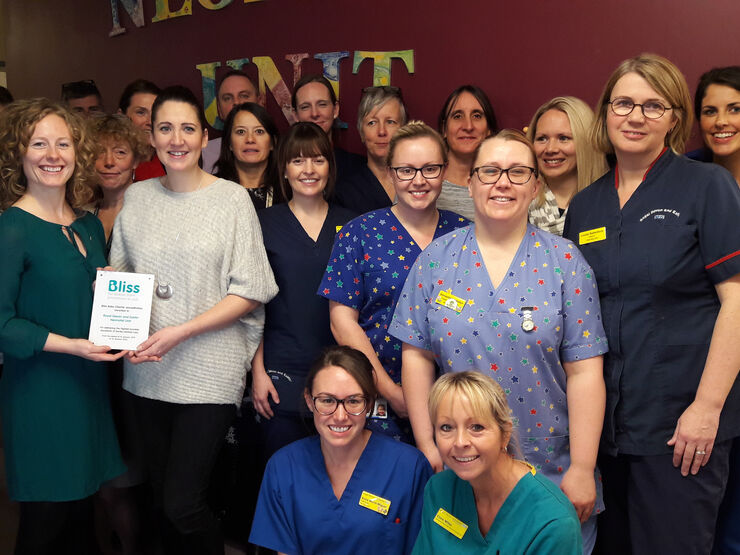 Staff at Royal Devon and Exeter hospital posing while holding a Bliss accreditation plaque