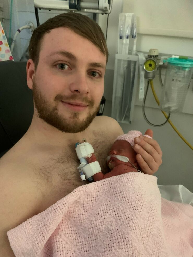 Tom having skin-to-skin with Gracie on the unit