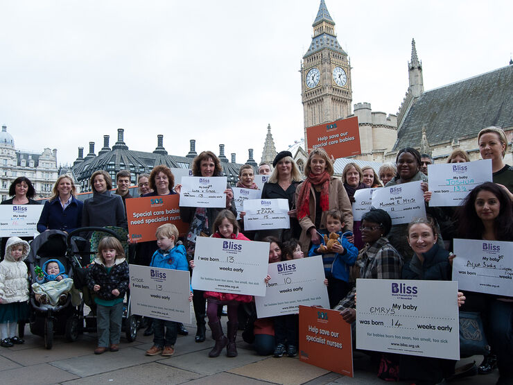 Campaigners outside Houses of Parliament with Bliss campaigning boards