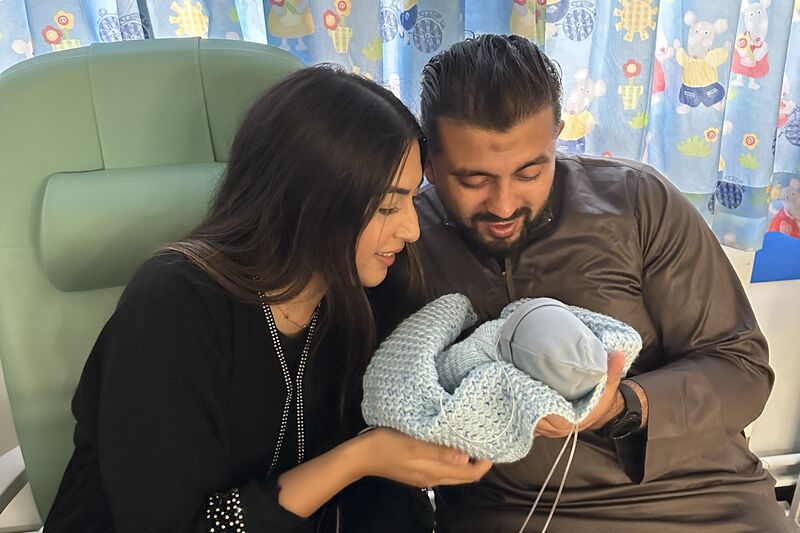 Farhaa and Wasim holding Riyadh