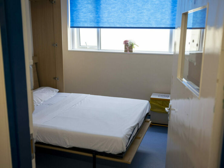 A small room with a fold-down bed.