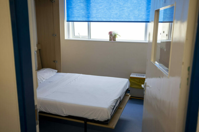 A small room with a fold-down bed.