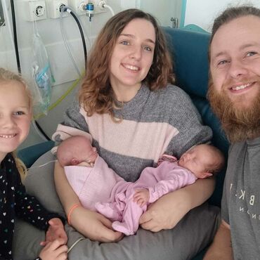 Family of five consisting of mum, dad, daughter and new-born twin babies.
