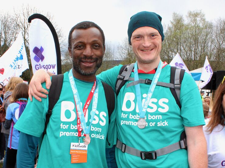 Two men in Bliss t-shirts at the finish line of the Glasgow Kiltwalk