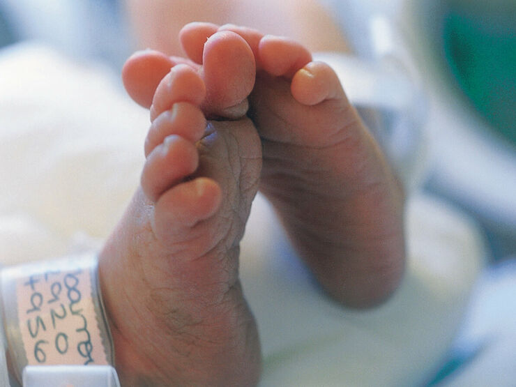 Premature baby's feet in a hospital setting