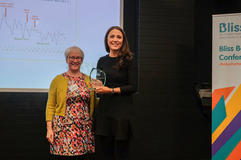 Dr. Still being presented award by Dr. Lydia Bowden