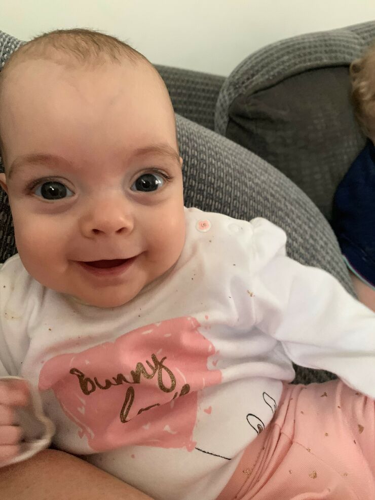 Elizabeth smiles happily now