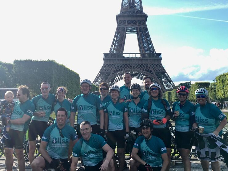 Team Bliss at the Eiffel Tower during London to Paris cycle challenge