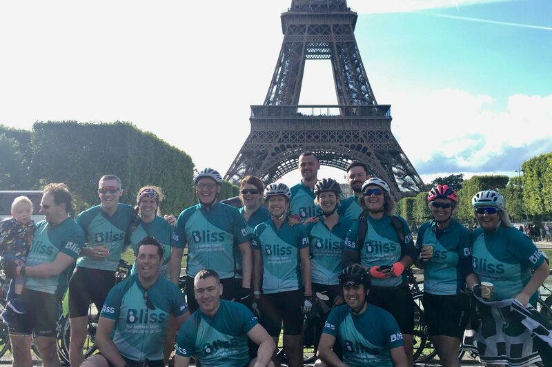 Team Bliss at the Eiffel Tower during London to Paris cycle challenge