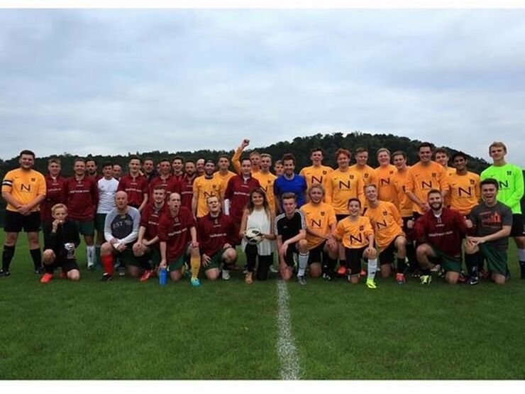 group of football players posing together