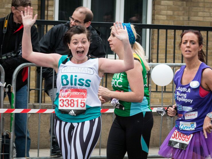 Lady wearing Bliss t-shirt excited whilst running