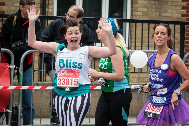 Lady wearing Bliss t-shirt excited whilst running