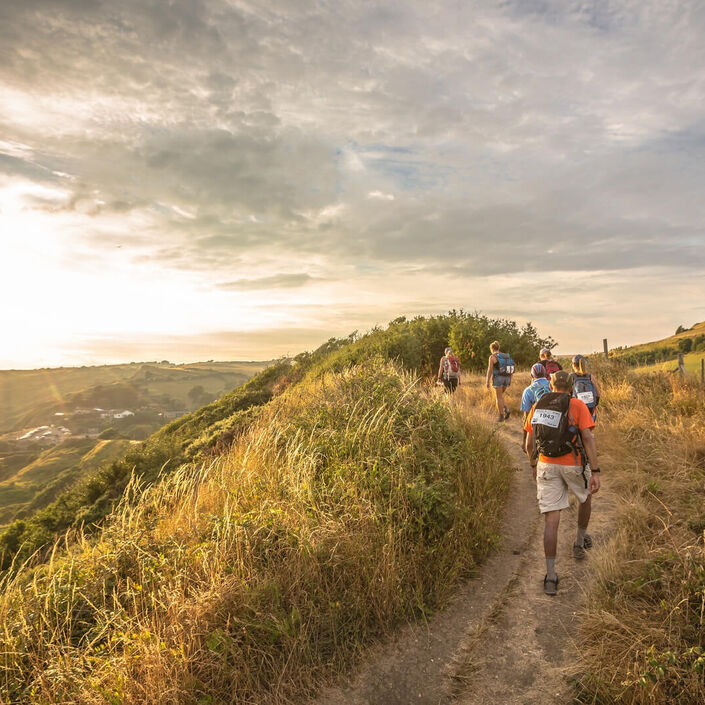 People hiking in the beautiful Yorkshire countryside during sunset