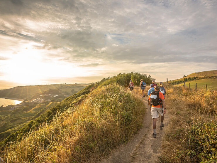 People hiking in the beautiful Yorkshire countryside during sunset