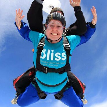 Supporter in the air during her skydive