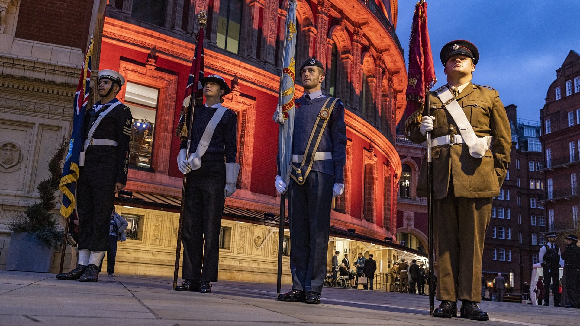 Cadets from Tr-services stand with flags outside the Royal Albert Hall