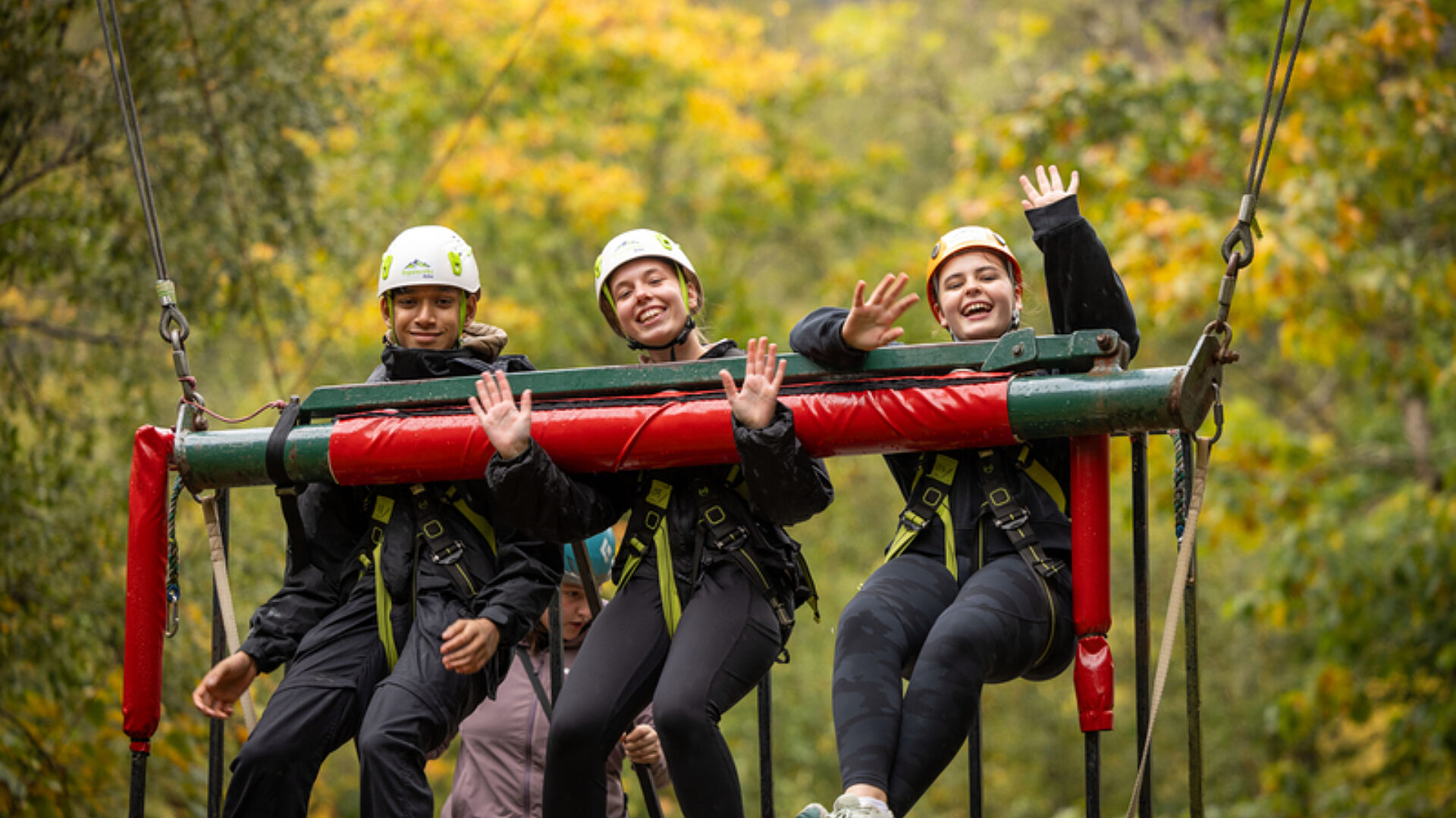 Smiling cadets adventurous training in the trees