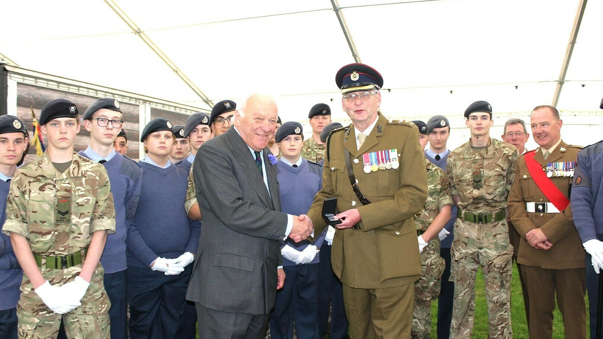 Cadet Colonel Ray Ogg receives his 6th comemorative clasp from Toby Dennis