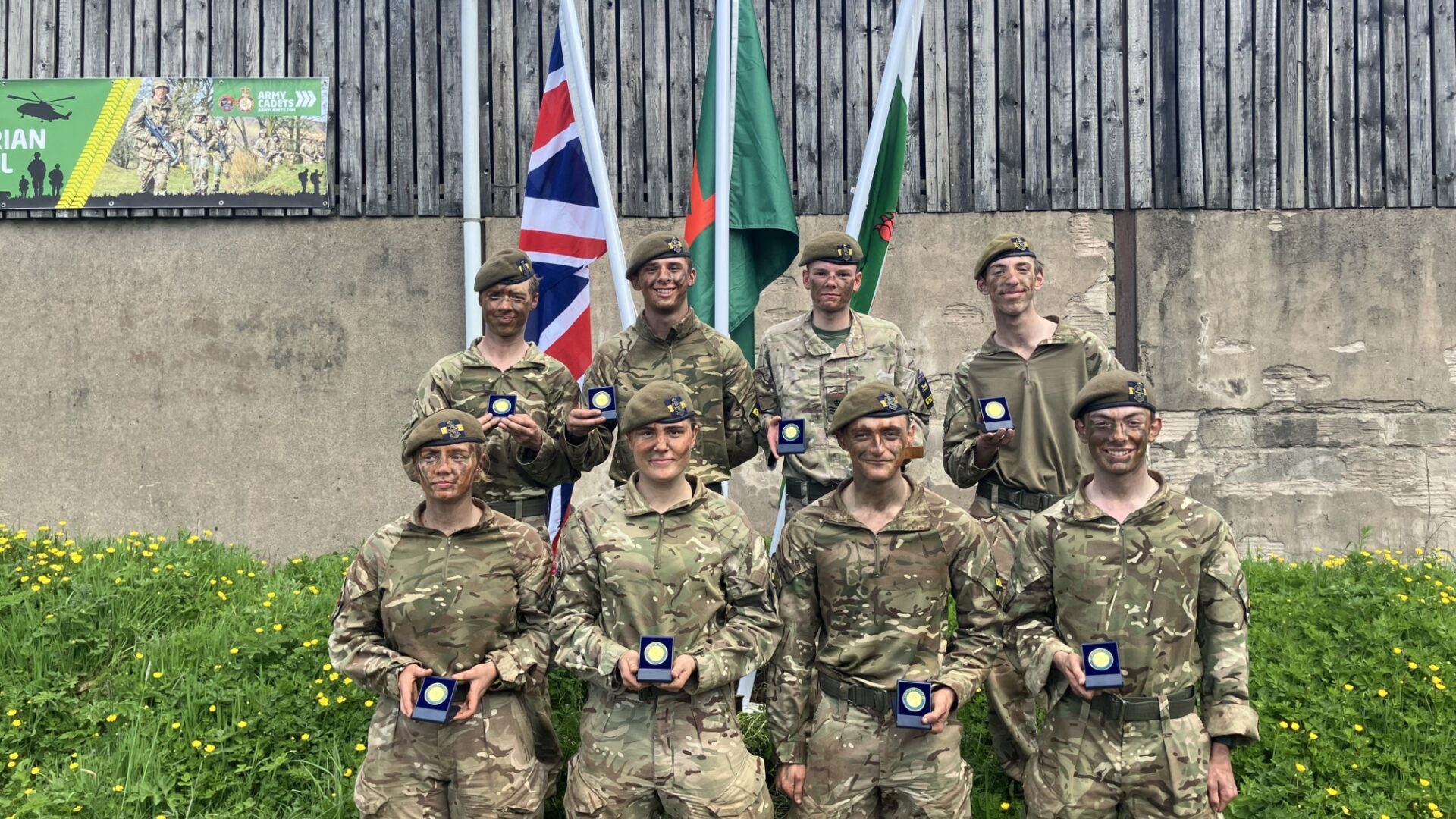 Gold medal winners showing off their medals at Caterham School CCF