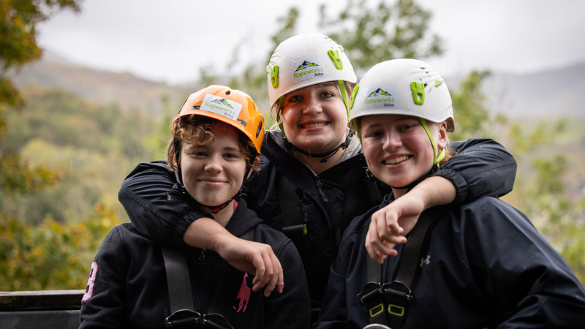 Happy cadets smiling together whilst in a forest adventurous training
